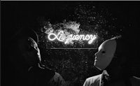 two people wearing masks in front of a neon sign